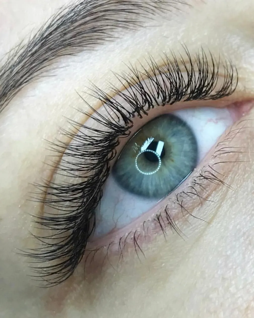 Close-up of a client's eye with a full set of lash extensions